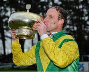 12 February 2017; Jockey Robbie Power kisses the Gold Cup after winning the Stan James Irish Gold Cup on Sizing John at Leopardstown. Leopardstown, Co. Dublin. Photo by Cody Glenn/Sportsfile
