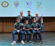 11 February 2017; The Donegal team, winners of the Tráth na gCeist, back row, centre, Ronan Gillespie, front row, from left, Anthony Molloy, Darragh Cunningham and Vincent Doherty, are presented with their medals and trophy by Antóin Mac Gabhann, Cathaoirleach Coiste Naisiúnta Scór, left, and Michael Hasson, Uachtarán Comhairle Uladh, at the Scór na nÓg Final 2017 at Waterfront Hotel in Belfast, Antrim. Photo by Piaras Ó Mídheach/Sportsfile