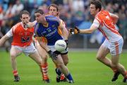 16 July 2011; Seanie Furlong, Wicklow, in action against Finnian Moriarty, 7, Kevin Dyas, behind, and Brendan Donaghy, 3, Armagh. GAA Football All-Ireland Senior Championship Qualifier, Round 2, Replay, Wicklow v Armagh, County Grounds, Aughrim, Co. Wicklow. Picture credit: Matt Browne / SPORTSFILE