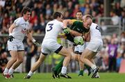 16 July 2011; Joe Sheridan, Meath, in action against, from left, Emmet Bolton, Michael Foley and Hugh McGrillen, Kildare. GAA Football All-Ireland Senior Championship Qualifier, Round 3, Meath v Kildare, Pairc Tailteann, Navan, Co. Meath. Picture credit: Pat Murphy / SPORTSFILE