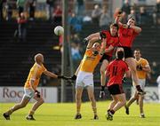 16 July 2011; Kalum King and Declan Rooney, Down, in action against Aodhan Gallagher, Antrim. GAA Football All-Ireland Senior Championship Qualifier, Round 3, Antrim v Down, Casement Park, Belfast, Co. Antrim. Picture credit: Oliver McVeigh / SPORTSFILE