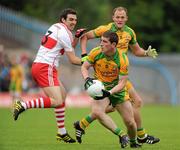 17 July 2011; Patrick McBrearty and Colm McFadden, right, Donegal, in action against Kevin McGuckin, Derry. Ulster GAA Football Senior Championship Final, Derry v Donegal, St Tiernach's Park, Clones, Co. Monaghan. Picture credit: Brian Lawless / SPORTSFILE