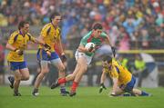 17 July 2011; Alan Freeman, Mayo, in action against Roscommon players left to right, Conor Devaney, Senan O'Grady and Niall Carty. Connacht GAA Football Senior Championship Final, Roscommon v Mayo, Dr. Hyde Park, Roscommon. Picture credit: David Maher / SPORTSFILE