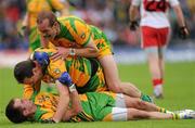 17 July 2011; Donegal captain Michael Murphy, centre, celebrates with team-mates Karl Lacey and Neil Gallagher, top, at the final whistle. Ulster GAA Football Senior Championship Final, Derry v Donegal, St Tiernach's Park, Clones, Co. Monaghan. Picture credit: Brian Lawless / SPORTSFILE