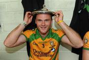 17 July 2011; Neil McGee, Donegal, celebrates with the lid of the Anglo Celt cup in the chaning rooms. Ulster GAA Football Senior Championship Final, Derry v Donegal, St Tiernach's Park, Clones, Co. Monaghan. Picture credit: Oliver McVeigh / SPORTSFILE