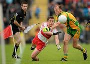 17 July 2011; Dermot McBride, Derry, in action against Colm McFadden, Donegal. Ulster GAA Football Senior Championship Final, Derry v Donegal, St Tiernach's Park, Clones, Co. Monaghan. Picture credit: Brendan Moran / SPORTSFILE