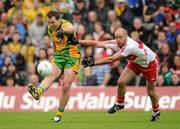 17 July 2011; Michael Murphy, Donegal, kicks for a score despite the best efforts of Kevin McCloy, Derry. Ulster GAA Football Senior Championship Final, Derry v Donegal, St Tiernach's Park, Clones, Co. Monaghan. Picture credit: Brendan Moran / SPORTSFILE