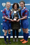 14 February 2017; Coláiste na Trócaire Rathkeale joint captains Eadaoin Lyons, left, and Kate Geary, are presented with the trophy from Ciara McGuigan, Bank of Ireland Youth Banking, following their victory in the Bank of Ireland FAI Schools Senior Girls National Cup Final match between Sacred Heart School Westport and Coláiste na Trócaire Rathkeale at Home Farm FC in Whitehall, Dublin. Photo by Cody Glenn/Sportsfile