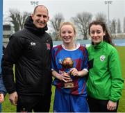 14 February 2017; Coláiste na Trócaire Rathkeale joint captain Eadaoin Lyons, centre, is presented with the Player of the Match award from Dundalk FC goalkeeper Gary Rogers and Roma McLaughlin, Republic of Ireland Under-19 International and Peamount United player, following her side's victory in the Bank of Ireland FAI Schools Senior Girls National Cup Final match between Sacred Heart School Westport and Coláiste na Trócaire Rathkeale at Home Farm FC in Whitehall, Dublin. Photo by Cody Glenn/Sportsfile
