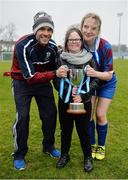 14 February 2017; Coláiste na Trócaire Rathkeale manager Killian Phair, Joanne Foley, right, and her sister Aine Foley, age 11, with the trophy following their victory in the Bank of Ireland FAI Schools Senior Girls National Cup Final match between Sacred Heart School Westport and Coláiste na Trócaire Rathkeale at Home Farm FC in Whitehall, Dublin. Photo by Cody Glenn/Sportsfile