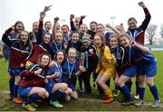 14 February 2017; Coláiste na Trócaire Rathkeale manager Killian Phair, centre, with the trophy and his players following their victory in the Bank of Ireland FAI Schools Senior Girls National Cup Final match between Sacred Heart School Westport and Coláiste na Trócaire Rathkeale at Home Farm FC in Whitehall, Dublin. Photo by Cody Glenn/Sportsfile