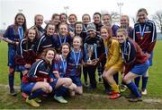 14 February 2017; Coláiste na Trócaire Rathkeale manager Killian Phair, centre, with the trophy and his players following their victory in the Bank of Ireland FAI Schools Senior Girls National Cup Final match between Sacred Heart School Westport and Coláiste na Trócaire Rathkeale at Home Farm FC in Whitehall, Dublin. Photo by Cody Glenn/Sportsfile