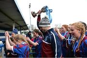 14 February 2017; Coláiste na Trócaire Rathkeale manager Killian Phair lifts the trophy as he and his players walk off the pitch following their victory in the Bank of Ireland FAI Schools Senior Girls National Cup Final match between Sacred Heart School Westport and Coláiste na Trócaire Rathkeale at Home Farm FC in Whitehall, Dublin. Photo by Cody Glenn/Sportsfile
