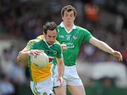 9 July 2011; Joe Quinn of Offaly in action against Ian Ryan of Limerick during the GAA Football All-Ireland Senior Championship Qualifier Round 2 match between Limerick and Offaly at Gaelic Grounds in Limerick. Photo by Stephen McCarthy/Sportsfile