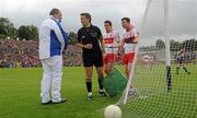17 July 2011; Derry captain Barry McGoldrick, right, and full-back Kevin McGuckin appeal to referee Maurice Deegan after he awarded Donegal a penalty. Ulster GAA Football Senior Championship Final, Derry v Donegal, St Tiernach's Park, Clones, Co. Monaghan. Picture credit: Brendan Moran / SPORTSFILE