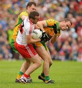 17 July 2011; Emmett McGuckin, Derry, collides with Neil McGee, Donegal, in the penalty area. Ulster GAA Football Senior Championship Final, Derry v Donegal, St Tiernach's Park, Clones, Co. Monaghan. Picture credit: Oliver McVeigh / SPORTSFILE