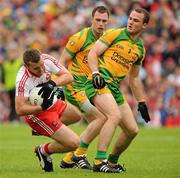 17 July 2011; Emmett McGuckin, Derry, collides with Neil McGee, Donegal, in the penalty area. Ulster GAA Football Senior Championship Final, Derry v Donegal, St Tiernach's Park, Clones, Co. Monaghan. Picture credit: Oliver McVeigh / SPORTSFILE