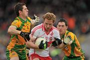 17 July 2011; Sean Leo McGoldrick, Derry, in action against Ryan Bradley, left, and Mark McHugh, Donegal. Ulster GAA Football Senior Championship Final, Derry v Donegal, St Tiernach's Park, Clones, Co. Monaghan. Picture credit: Brendan Moran / SPORTSFILE