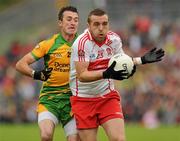 17 July 2011; Emmett McGuckin, Derry, in action against David Walsh, Donegal. Ulster GAA Football Senior Championship Final, Derry v Donegal, St Tiernach's Park, Clones, Co. Monaghan. Picture credit: Oliver McVeigh / SPORTSFILE