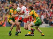 17 July 2011; Joe Diver, Derry, in action against Neil Gallagher and Martin McElhinney, Donegal. Ulster GAA Football Senior Championship Final, Derry v Donegal, St Tiernach's Park, Clones, Co. Monaghan. Picture credit: Oliver McVeigh / SPORTSFILE