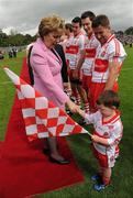 17 July 2011; The President of Ireland Mary McAleese meets Derry mascot Donal O'Connor, aged 4. Ulster GAA Football Senior Championship Final, Derry v Donegal, St Tiernach's Park, Clones, Co. Monaghan. Picture credit: Oliver McVeigh / SPORTSFILE