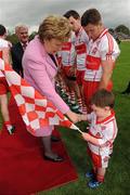 17 July 2011; The President of Ireland Mary McAleese meets Derry mascot Donal O'Connor, aged 4. Ulster GAA Football Senior Championship Final, Derry v Donegal, St Tiernach's Park, Clones, Co. Monaghan. Picture credit: Oliver McVeigh / SPORTSFILE