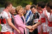 17 July 2011; The President of Ireland Mary McAleese shakes hands with Kevin McGuckin, Derry. Ulster GAA Football Senior Championship Final, Derry v Donegal, St Tiernach's Park, Clones, Co. Monaghan. Picture credit: Oliver McVeigh / SPORTSFILE