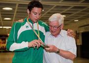 18 July 2011; Ireland's Brian Gregan, Silver Medalist in the Mens 400m, with his coach John Shields, on his arrival in Dublin Airport as the Irish Team return from the European Under 23 Championships in Ostrava. Dublin Airport, Dublin. Picture credit: Barry Cregg / SPORTSFILE