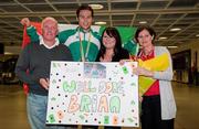 18 July 2011; Ireland's Brian Gregan, Silver Medalist in the Mens 400m, with his parents Brian and Marion and his sister Lynn, on his arrival in Dublin Airport as the Irish Team return from the European Under 23 Championships in Ostrava. Dublin Airport, Dublin. Picture credit: Barry Cregg / SPORTSFILE