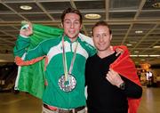18 July 2011; Ireland's Brian Gregan, Silver Medalist in the Mens 400m, with his strength and conditioning coach John Kelly, on his arrival in Dublin Airport as the Irish Team return from the European Under 23 Championships in Ostrava. Dublin Airport, Dublin. Picture credit: Barry Cregg / SPORTSFILE