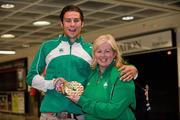 18 July 2011; Ireland's Brian Gregan, Silver Medalist in the Mens 400m, with Ireland team manager Theresa McDaid, on their arrival in Dublin Airport as the Irish Team return from the European Under 23 Championships in Ostrava. Dublin Airport, Dublin. Picture credit: Barry Cregg / SPORTSFILE