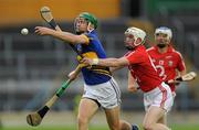 15 July 2011; Noel McGrath, Tipperary, in action against John O'Neill, Cork. Bord Gáis Energy Munster GAA Hurling Under 21 Championship Semi-Final, Tipperary v Cork, Semple Stadium, Thurles, Co. Tipperary. Picture credit: Brian Lawless / SPORTSFILE