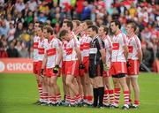 17 July 2011; The Derry players stand for the National Anthem. Ulster GAA Football Senior Championship Final, Derry v Donegal, St Tiernach's Park, Clones, Co. Monaghan. Picture credit: Brian Lawless / SPORTSFILE