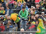 17 July 2011; Donegal supporters climb a fence to get to the pitch after the match. Ulster GAA Football Senior Championship Final, Derry v Donegal, St Tiernach's Park, Clones, Co. Monaghan. Picture credit: Brian Lawless / SPORTSFILE