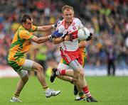 17 July 2011; Martin Donaghy, Derry, in action against Karl Lacey, Donegal. Ulster GAA Football Senior Championship Final, Derry v Donegal, St Tiernach's Park, Clones, Co. Monaghan. Picture credit: Brian Lawless / SPORTSFILE