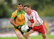 17 July 2011; Conleith Gilligan, Derry, in action against Frank McGlynn, Donegal. Ulster GAA Football Senior Championship Final, Derry v Donegal, St Tiernach's Park, Clones, Co. Monaghan. Picture credit: Brian Lawless / SPORTSFILE