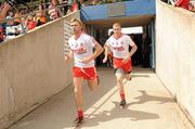 26 June 2011; Tyrone's Owen Mulligan, left, and Kevin Hughes run out for the start of the game. Ulster GAA Football Senior Championship Semi-Final, Tyrone v Donegal, St Tiernach's Park, Clones, Co. Monaghan. Picture credit: Oliver McVeigh / SPORTSFILE