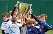 20 July 2011; 'Stars of the future' who attended the Volkswagen Leinster Summer Camp at Lansdowne Rugby Club raise aloft the Heineken Cup. Lansdowne Road, Dublin. Picture credit: Ray McManus / SPORTSFILE