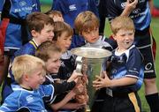 20 July 2011; 'Stars of the future' who attended the Volkswagen Leinster Summer Camp at Lansdowne Rugby Club gather round the Heineken Cup. Lansdowne Road, Dublin. Picture credit: Ray McManus / SPORTSFILE