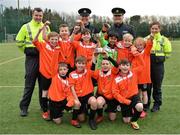 16 February 2017; The champions from St Brigid's Boys National School Killester with, from left, Garda John Hanrahn, from the Clontarf Station, Inspector Jim McDermott, Chief Barry O'Brien, based in Ballymun Station, and Garda Caroline Maye, from the Clontarf Station, during an FAI and Garda initiative, run with the cooperation of Dublin City Council, to promote the messages of &quot;Show Racism the Red Card,&quot; anti-bullying, and personal safety. The football blitz involving ten local schools, FAI Project Futsal Ballymun and the FAI Transition Year, took place at the Alfie Byrne Road All-Weather Pitch in Clontarf, Dublin. Photo by Cody Glenn/Sportsfile