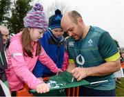 17 February 2017; Rory Best of Ireland signs a flag for Molly McManus, age 8, from Lisnaskea, Co Fermanagh, following an open training session at the Monaghan RFC grounds in Co. Monaghan. Photo by Seb Daly/Sportsfile