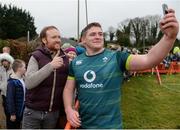 17 February 2017; Tadhg Furlong of Ireland poses for a selfie with a supporter following an open training session at the Monaghan RFC grounds in Co. Monaghan. Photo by Seb Daly/Sportsfile