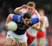 9 July 2011; Francis McGee, Longford, in action against Dermot Carlin, Tyrone. GAA Football All-Ireland Senior Championship Qualifier Round 2, Longford v Tyrone, Pearse Park, Co. Longford. Picture credit: Brendan Moran / SPORTSFILE