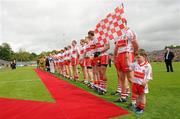 17 July 2011; Derry mascot four year old Donal O'Connor waiting alongside the teams to meet the President of Ireland Mary McAleese. Ulster GAA Football Senior Championship Final, Derry v Donegal, St Tiernach's Park, Clones, Co. Monaghan. Picture credit: Oliver McVeigh / SPORTSFILE