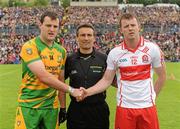 17 July 2011; Donegal Captain Michael Murphy, shakes hands with Derry Captain Bary McGoldrick, watched by  Referee Maurice Deegan. Ulster GAA Football Senior Championship Final, Derry v Donegal, St Tiernach's Park, Clones, Co. Monaghan. Picture credit: Oliver McVeigh / SPORTSFILE