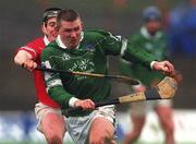 25 February 2002; Mark Foley of Limerick in action against Cork's Pat Ryan during the Allianz National Hurling League Division 1B Round 1 match between Limerick and Cork at the Gaelic Grounds in Limerick. Photo by Brendan Moran/Sportsfile