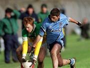23 February 2002; Pascal Kelleghan of Offaly in action against David Henry of Dublin during the Allianz National Football League Division 1A match between Offaly and Dublin at O'Connor Park in Tullamore, Offaly. Photo by Brian Lawless/Sportsfile