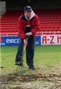 26 February 2002; St Patrick's Athletic head groundsman Gerard Foster tends to the Richmond Park pitch following the postponement of the eircom League Premier Division match between St Patrick's Athletic and Derry City at richmond Park in Dublin. Photo by Damien Eagers/Sportsfile
