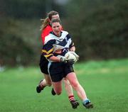 19 February 2002; Elaine Murphy of UCD is tackled by Meadbh De Nais of UCC during the Higher Education League Ladies Football Final between UCD and UCC at Donnybrook in Dublin. Photo by Aofie Rice/Sportsfile
