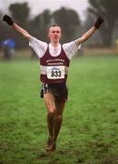 24 February 2002; Mark Christie of Mullingar Harriers AC celebrates as he crosses the line to win the Junior Men's race at the Inter Club Cross Country Championships of Ireland at the ALSAA Complex in Dublin. Photo by Brian Lawless/Sportsfile